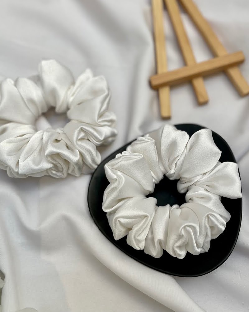 tylish Pearl White scrunchies with elegant white tones, perfect for adding a chic and sophisticated touch to your hairstyles and complementing any outfit with timeless elegance