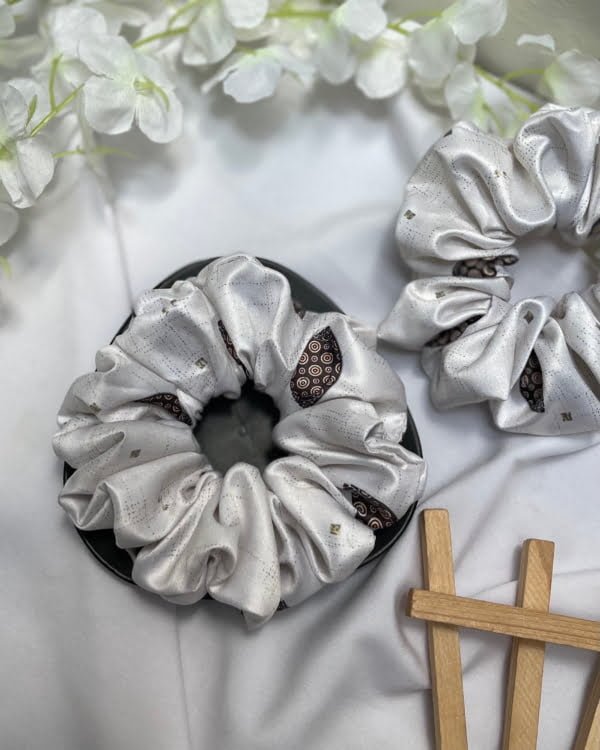 Stylish Shell scrunchies with neutral tones, perfect for adding a chic and versatile touch to your hairstyles, ideal for embracing natural beach vibes.