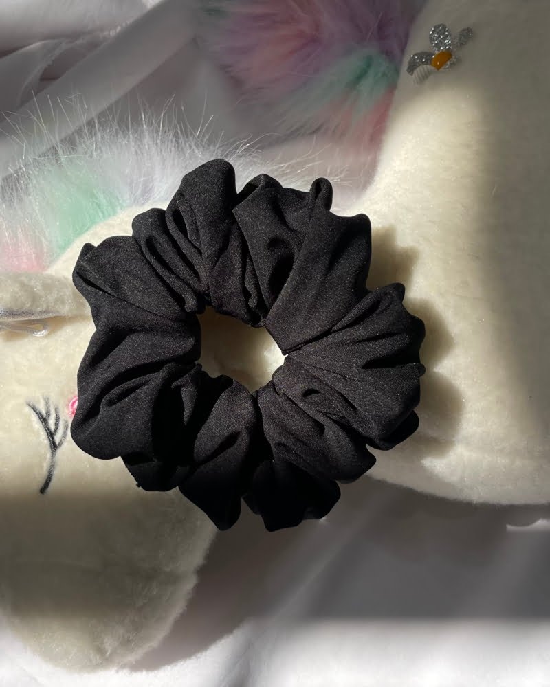 Stylish Fancy American Black scrunchies, perfect for adding a classic and elegant touch to your hairstyles, complementing any outfit with timeless beauty.