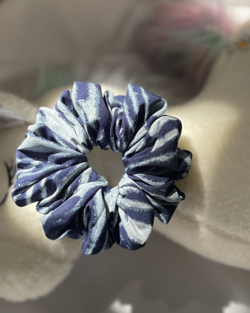 Stylish Blue Zeb scrunchies with bold animal print patterns, perfect for adding a chic and wild touch to your hairstyles, making a fashionable statement