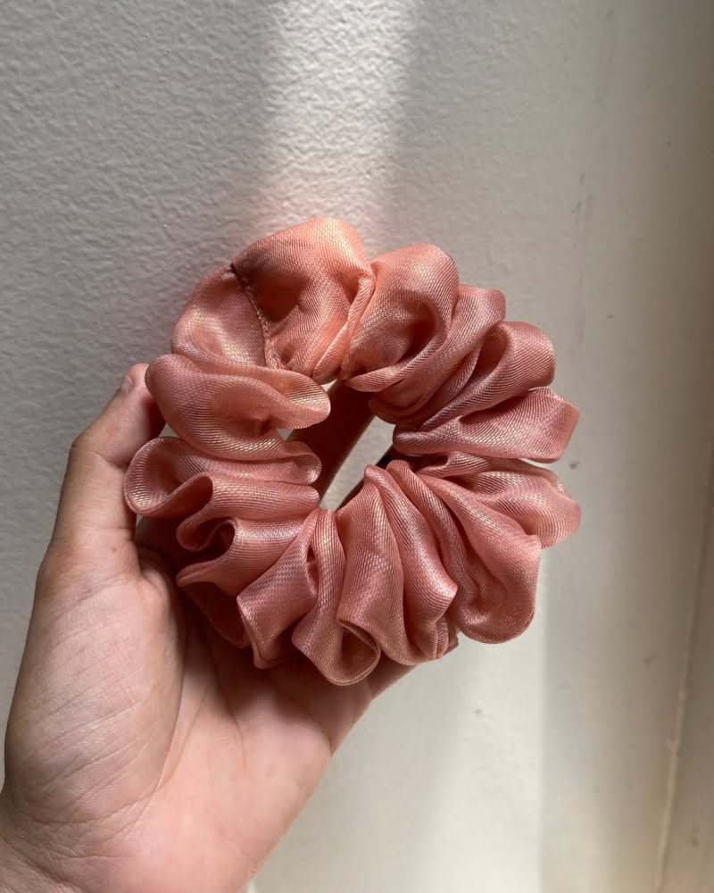 Stylish Mauve Shimmer scrunchies with mauve tones, perfect for adding a sophisticated and feminine touch to your hairstyles, exuding fashionable shimmer.