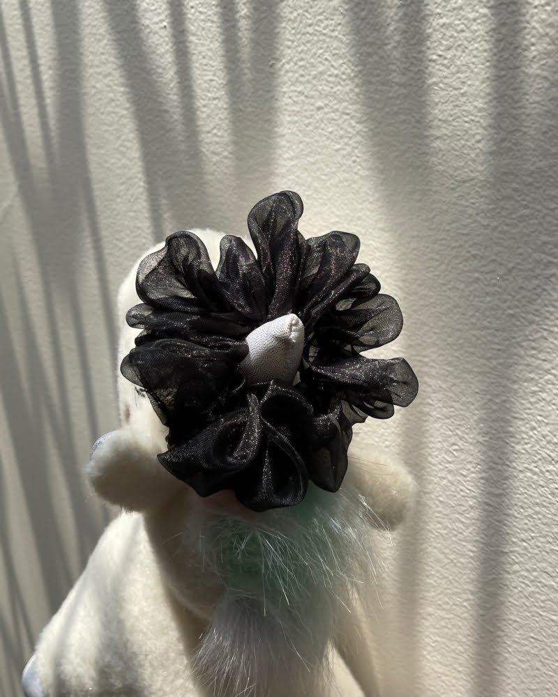 Jet scrunchies with classic black tones, perfect for adding a bold and chic touch to your hairstyles and outfits