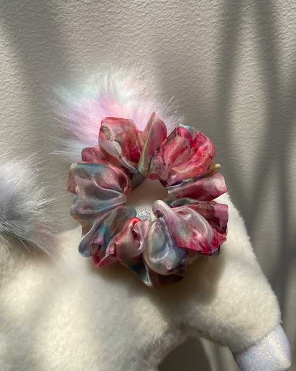 Stylish Cotton Candy scrunchies with pastel tones, perfect for adding a playful and chic touch to your hairstyles, exuding a sweet and delicate charm.