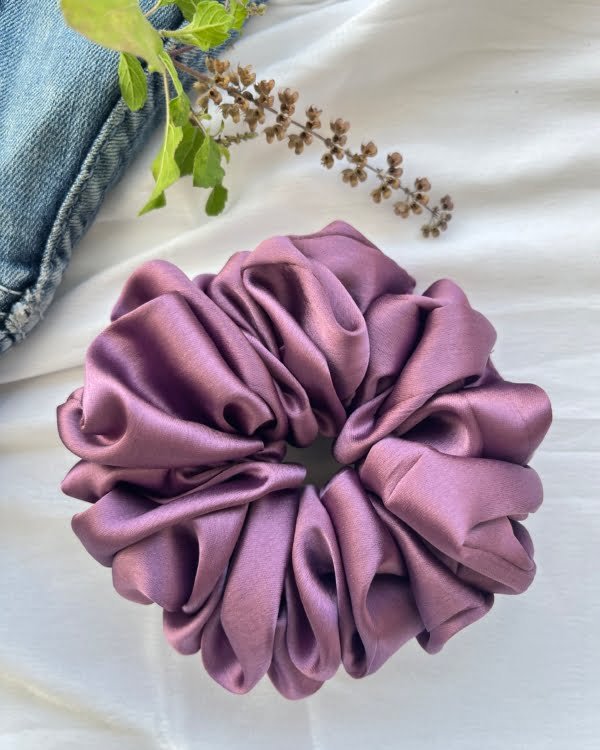 Stylish Emma Giant scrunchies, perfect for adding a trendy and chic touch to your hairstyles and making a bold fashion statement.