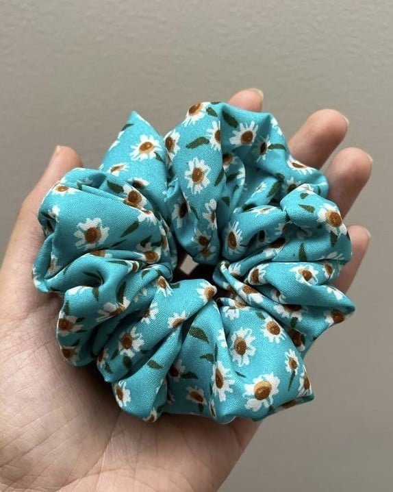 Floral Blue Quirky Flora scrunchies, perfect for adding a touch of nature-inspired charm to your hairstyles, featuring a colorful and whimsical floral pattern.