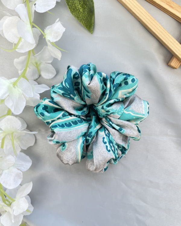 Stylish Calla scrunchies with elegant white tones, perfect for adding sophistication and chic flair to your hairstyles, embracing classic charm with a fashionable flair.