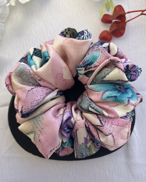 Feminine Rosy Ruffles scrunchies with pink tones, perfect for a stylish touch to your hairstyles, adorned with elegant ruffled designs.