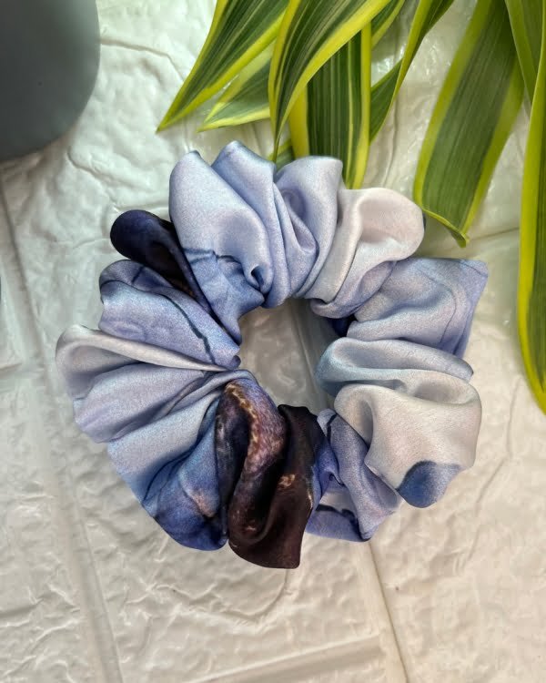 Discover soothing charm with our Periwinkle Blue scrunchies collection. These hair accessories in soft blue tones add a chic and elegant touch to any outfit.